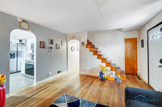 living room with light hardwood / wood-style flooring