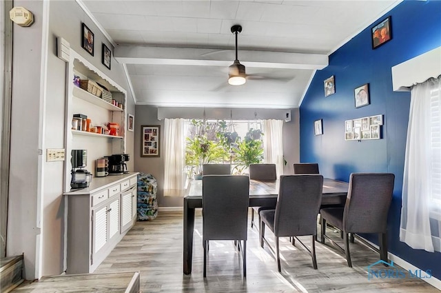 dining space with lofted ceiling with beams, light hardwood / wood-style floors, and ceiling fan