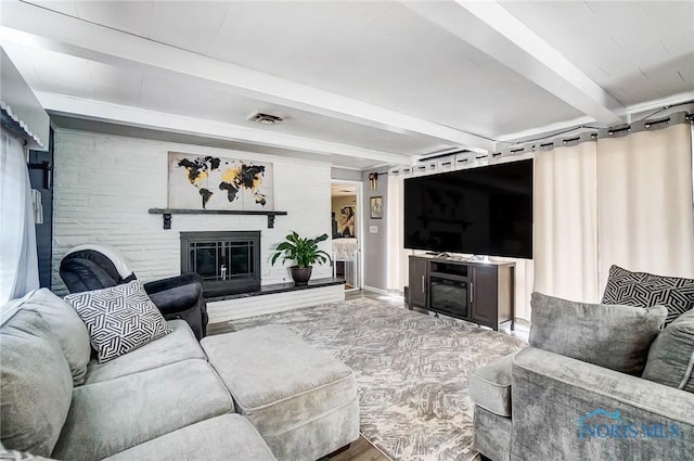 living room featuring beam ceiling