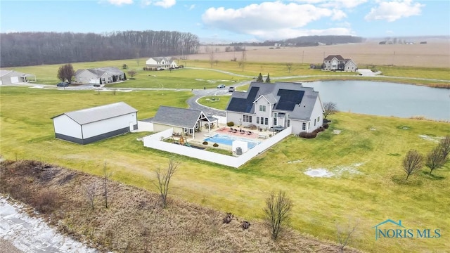 drone / aerial view featuring a rural view and a water view