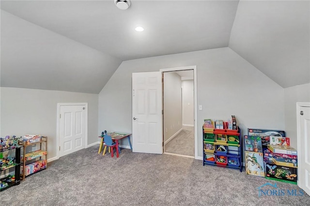 playroom featuring carpet and vaulted ceiling