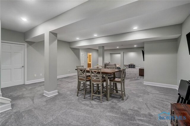 dining space with carpet flooring