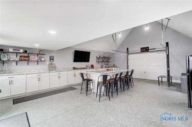 interior space featuring vaulted ceiling