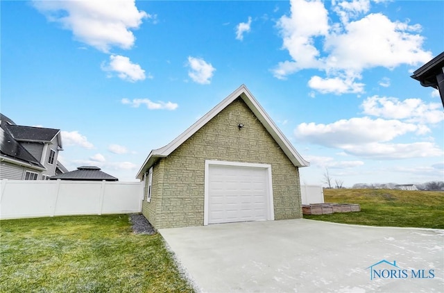 garage featuring a lawn