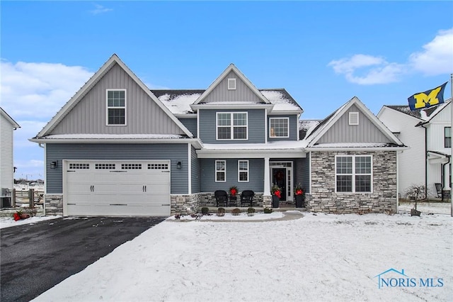 craftsman house featuring central AC and a garage