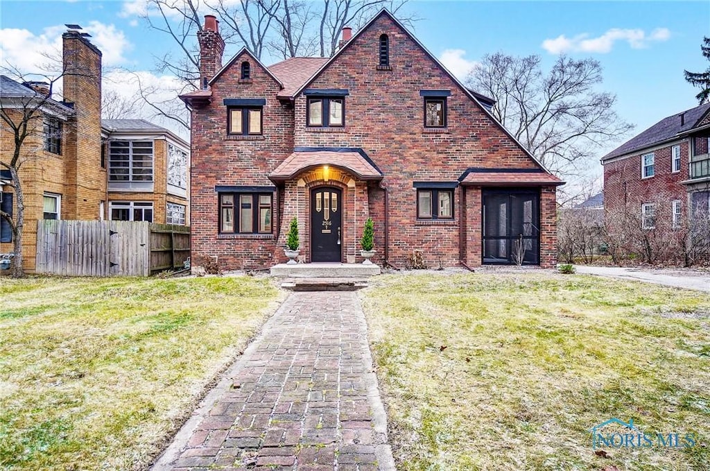 tudor house with a front yard