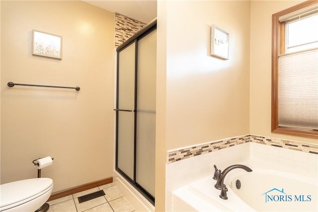 bathroom featuring tile patterned floors, separate shower and tub, and toilet