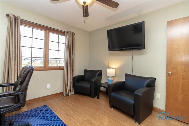 office area with ceiling fan and light hardwood / wood-style flooring