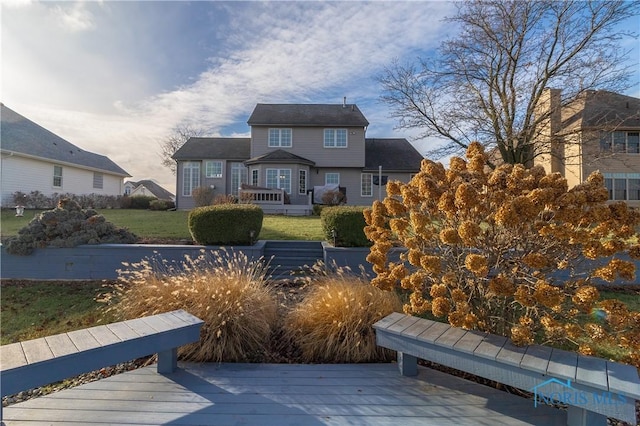 exterior space with a lawn and a deck