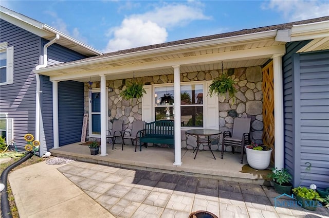 view of exterior entry featuring a porch