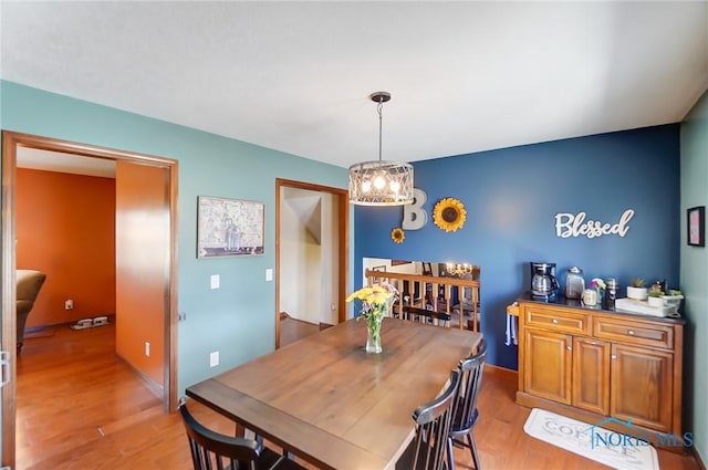 dining space with light hardwood / wood-style floors