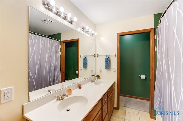 bathroom featuring tile patterned floors and vanity