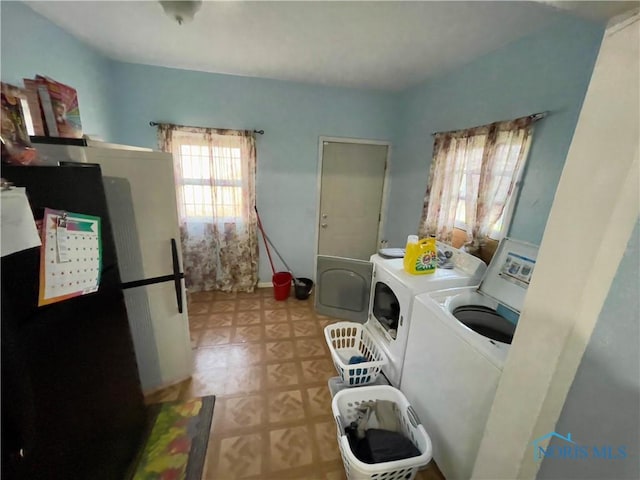 laundry room featuring washing machine and dryer