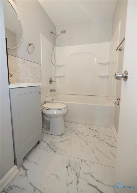 full bathroom featuring vanity,  shower combination, and toilet