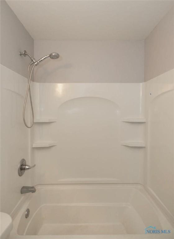 bathroom with shower / bath combination