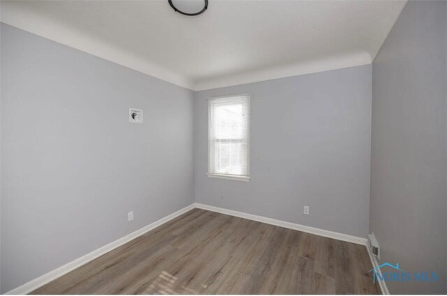 empty room featuring hardwood / wood-style floors