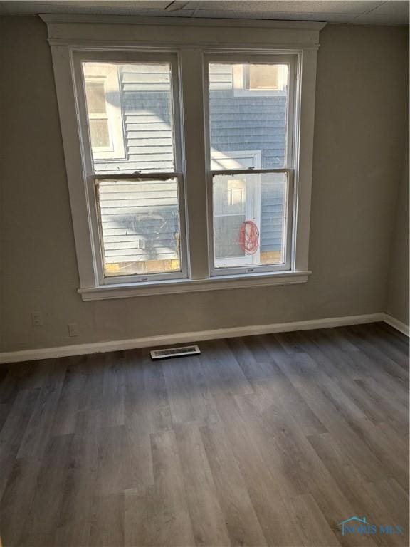 empty room featuring dark wood-type flooring