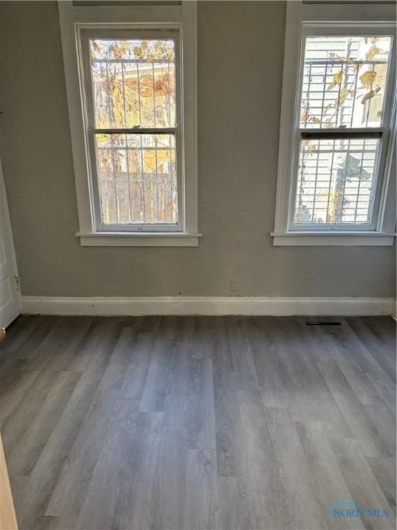 spare room featuring hardwood / wood-style floors