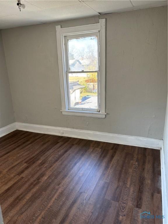 empty room featuring dark hardwood / wood-style floors