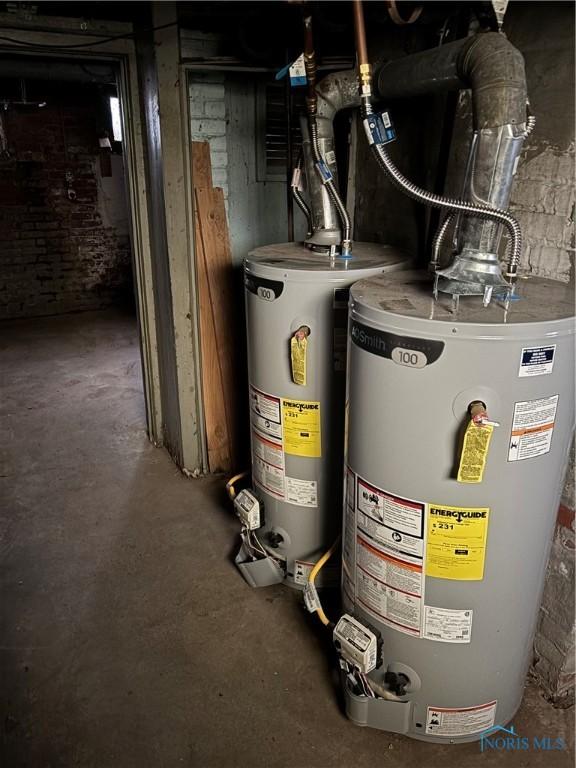 utility room featuring water heater