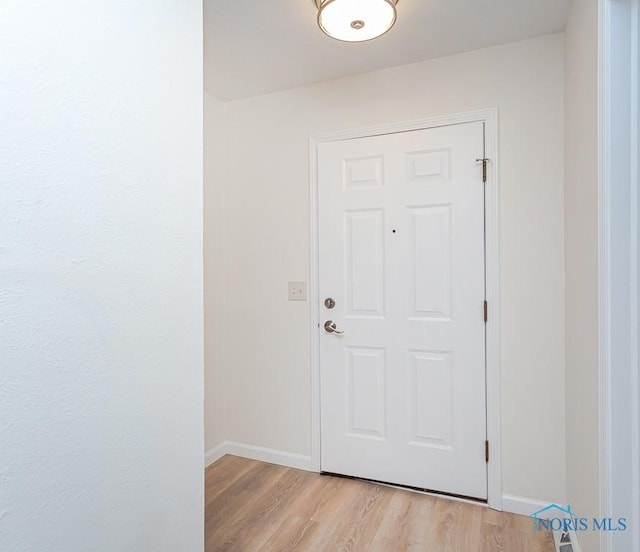 doorway to outside featuring light hardwood / wood-style flooring