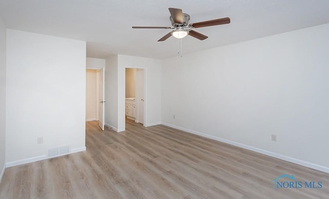 unfurnished bedroom with ceiling fan, light hardwood / wood-style floors, and ensuite bath