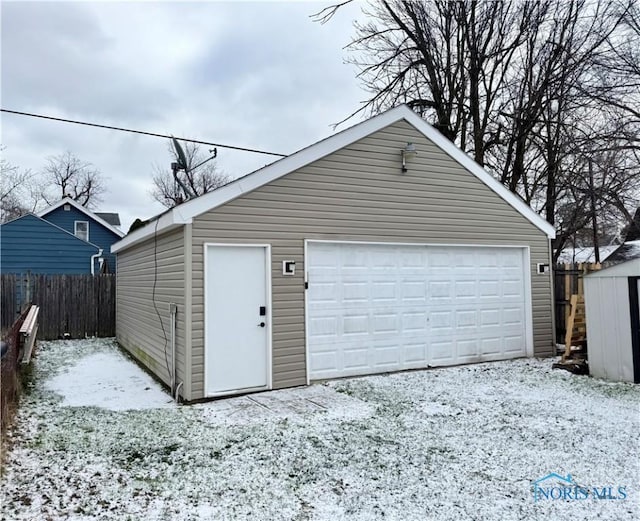 view of snow covered garage