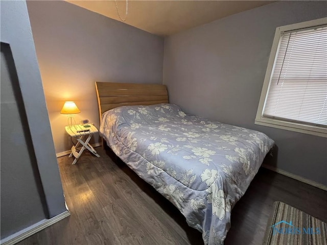 bedroom featuring dark wood-type flooring