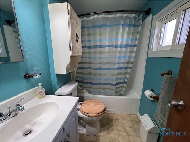 full bathroom featuring shower / tub combo, vanity, and toilet