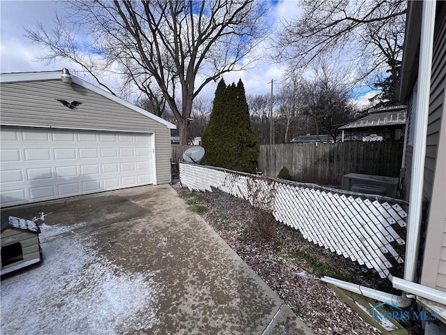 exterior space with an outbuilding and a garage