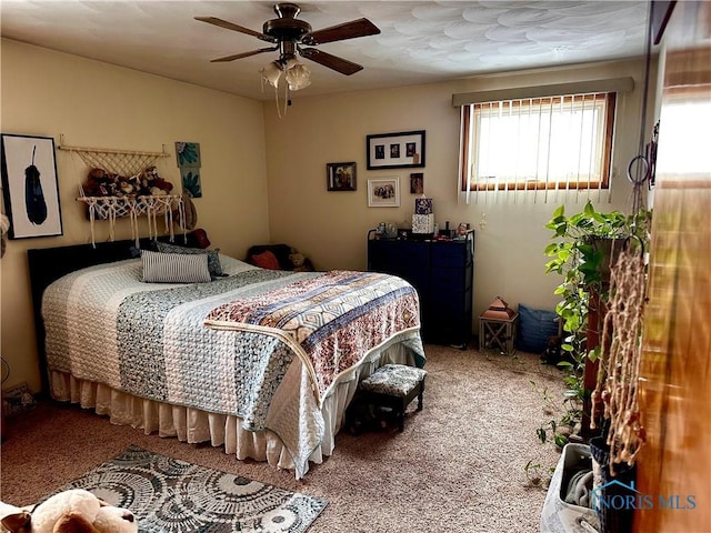 bedroom featuring carpet and ceiling fan