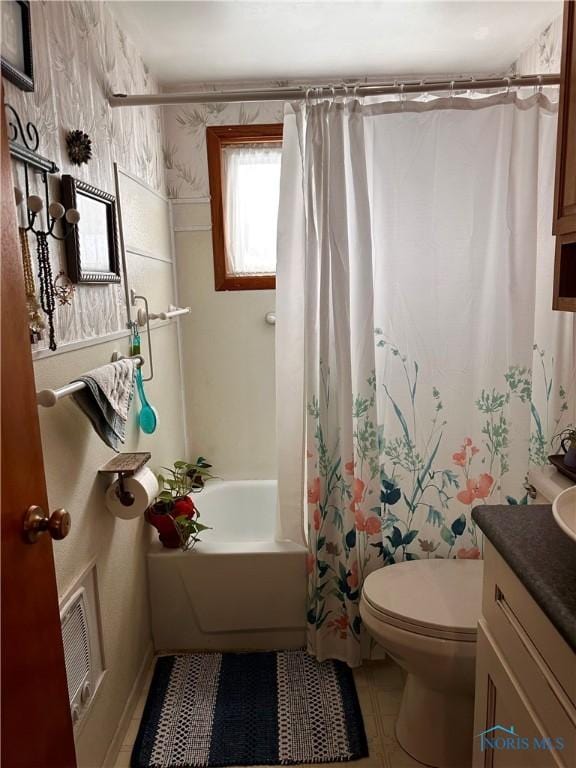 full bathroom with vanity, tile patterned flooring, shower / bath combo, and toilet