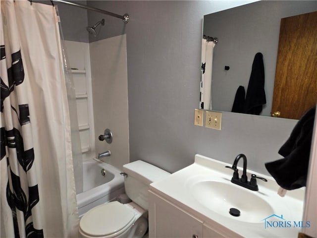 full bathroom featuring shower / bath combo, vanity, and toilet