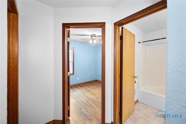 hallway with light wood-type flooring