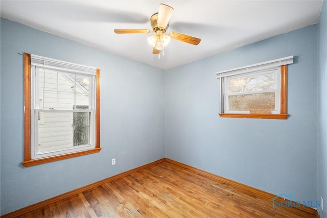 unfurnished room featuring light hardwood / wood-style floors and ceiling fan