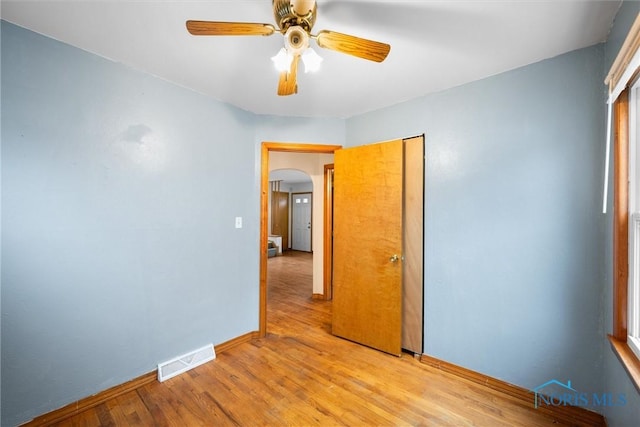 spare room with ceiling fan and light hardwood / wood-style floors