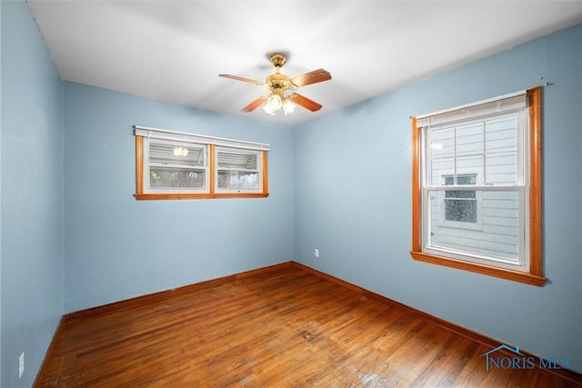 spare room featuring ceiling fan and wood-type flooring