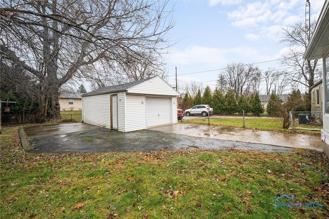 garage featuring a yard