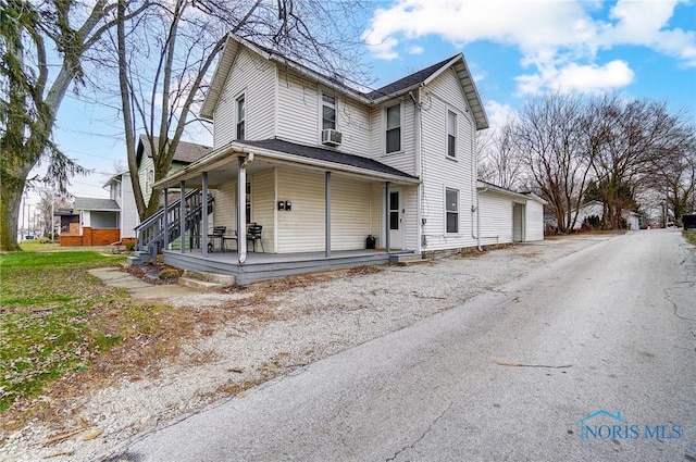 view of front of property with a porch and cooling unit