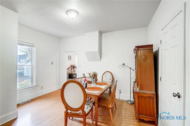 dining room with light wood-type flooring