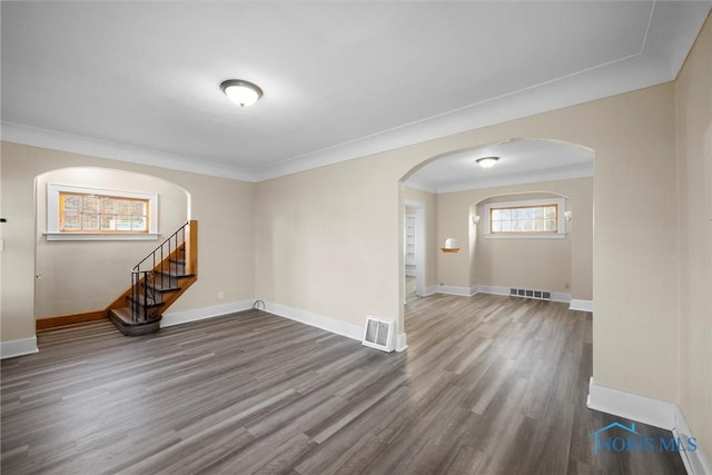 unfurnished room featuring hardwood / wood-style floors and ornamental molding