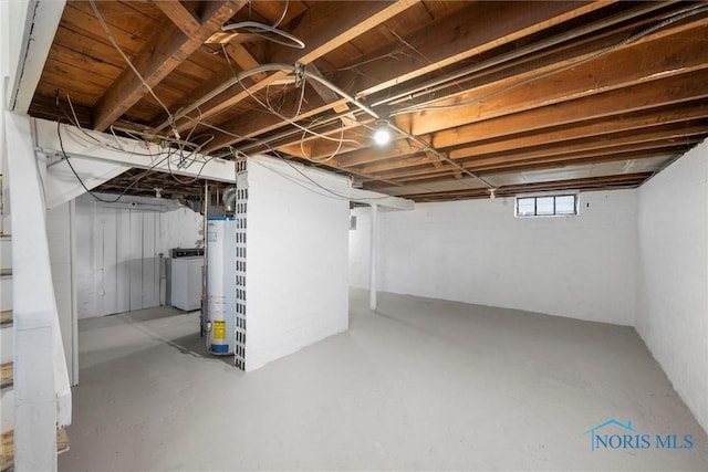 basement with washer / dryer and water heater