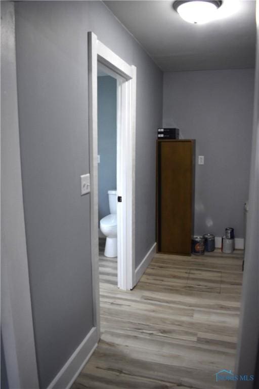 corridor featuring light hardwood / wood-style flooring