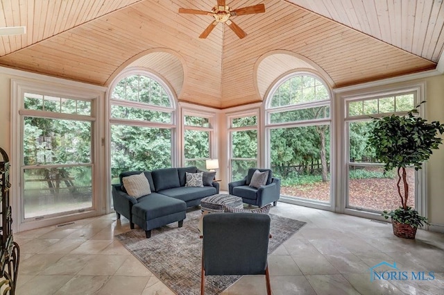 sunroom / solarium with ceiling fan, wood ceiling, and vaulted ceiling