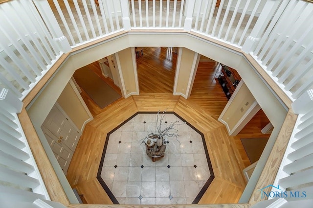 staircase with a towering ceiling