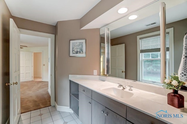 bathroom featuring tile patterned flooring and vanity