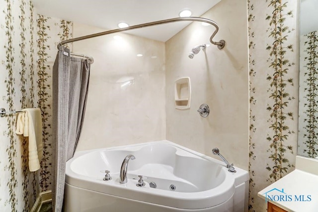 bathroom with vanity and independent shower and bath