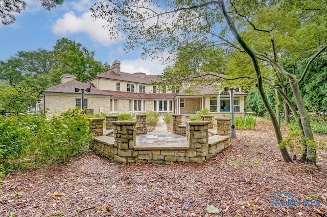 back of property featuring a patio area