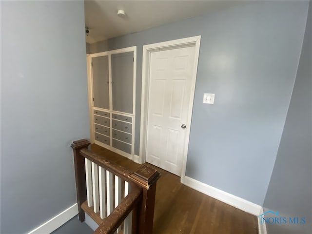 hall with dark hardwood / wood-style floors