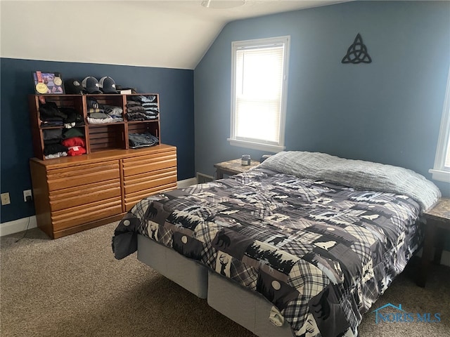 carpeted bedroom with vaulted ceiling